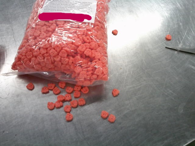 Bag of Franken Berry cereal with label and some spilled.